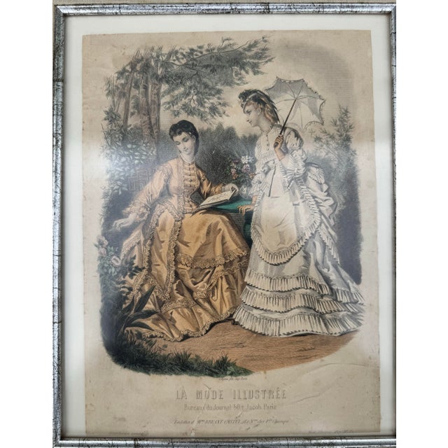 Original hand-colored French fashion plate from La Mode Illustrée, dated 1871 (No. 25) and published in Paris. This...
