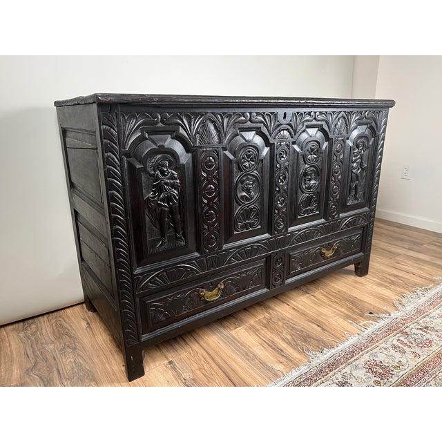 This impressive antique mule chest is executed in the Charles II style, with bold architectural carving and deeply worked...