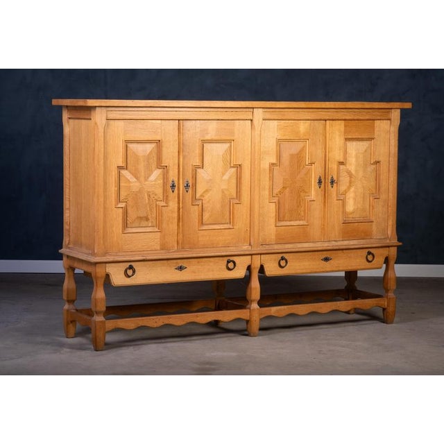 Oak sideboard in a distinctive brutalist style, designed by henning kjærnulf and produced by eg møbler in the 1970s. The...