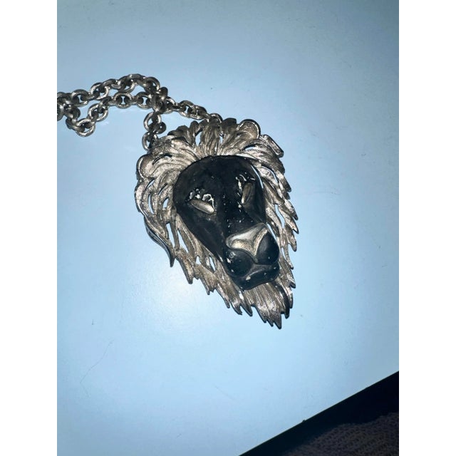1970s heavy Razza necklace in black and silver with a lion head. Highly collectible.