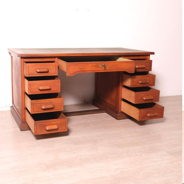 Beautiful 1940s desk by Ferretti. Green top, 0 drawers, 8 side drawers, and one center drawer, with compartments. A...