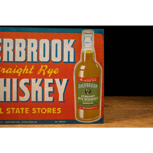 Colorful mid-20th-century tin lithograph advertising sign for Overbrook Straight Rye Whiskey, produced by Brookside...