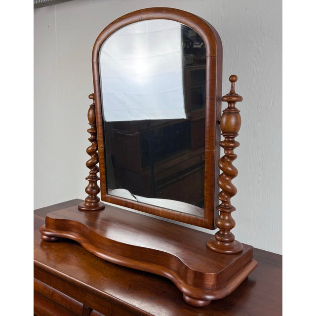 A striking late 19th century mahogany tilting shaving / vanity mirror with barley twist uprights and contoured mahogany base.