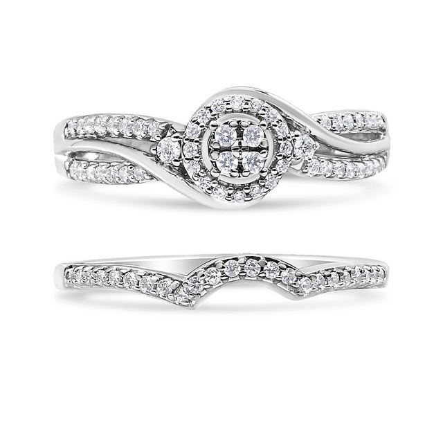 Introducing a dazzling masterpiece crafted with utmost precision and elegance. This .925 Sterling Silver Bridal Set Ring...