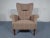This armchair from the 1950s features the original woolen fabric and was made in a style reminiscent of Fritz Hansen.
