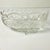 This is a Mid-Century pressed glass Oval Serving Bowl. It features a sawtooth rim and flora botanical frosted accents. The...