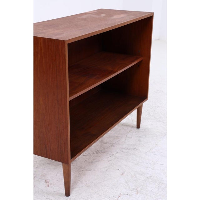 Vintage shelf from Musterring with clean lines and beautiful teak grain. The open design creates a light and airy feel and...