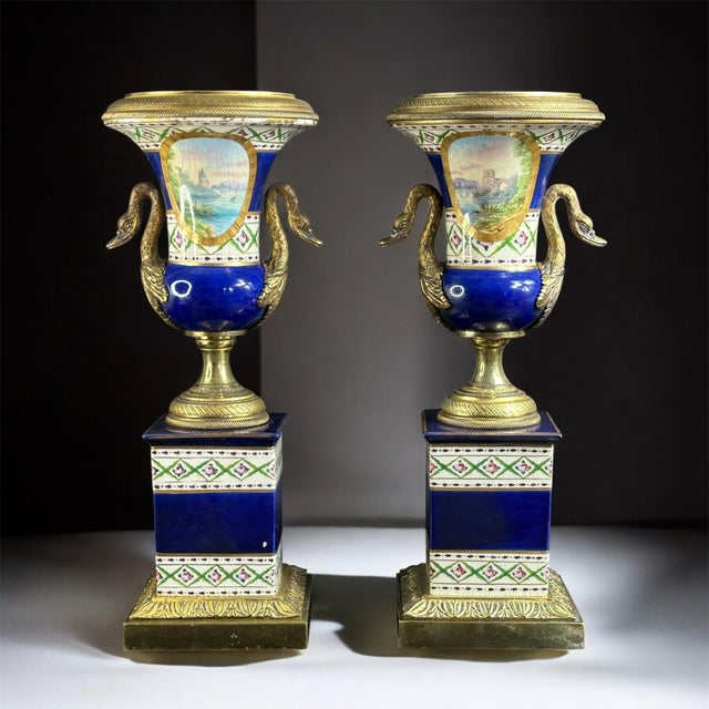 A remarkable pair of French porcelain and gilt bronze vases in the Sèvres style, richly decorated with hand-painted...