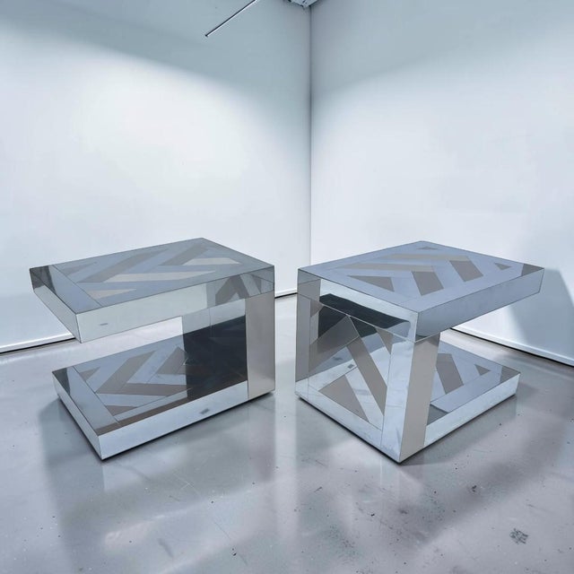 Stunning 1970s vintage Ello chrome and bronze side tables. These C-shape side tables are made in a city scape style with...