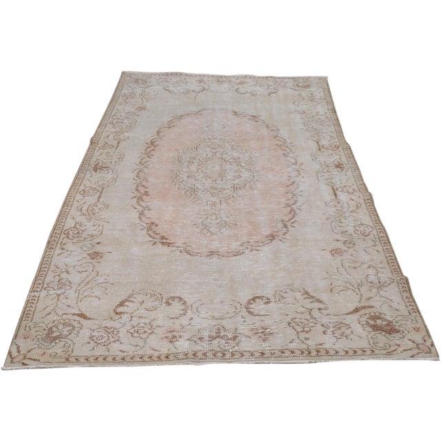 Hand-knotted with care using traditional rug-making techniques, this wool rug blends timeless craftsmanship with a modern...