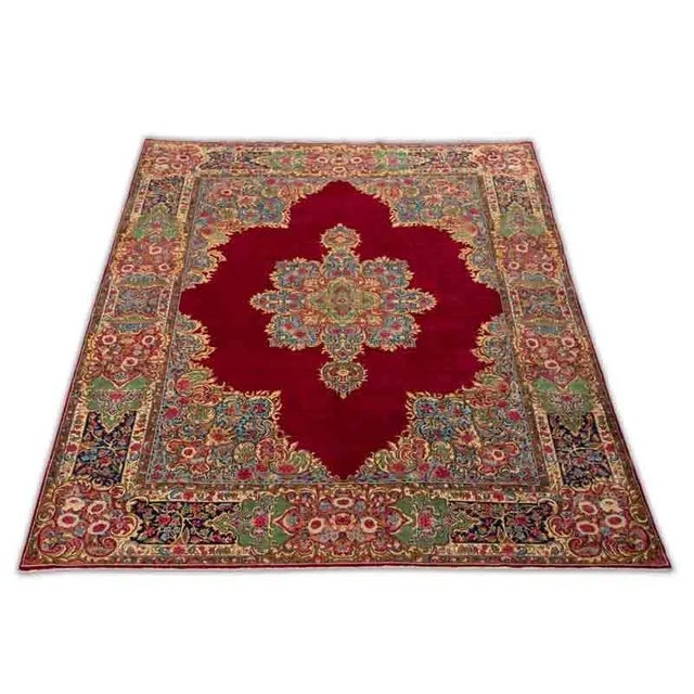 ACTUAL SIZE: 9’10” x 12’6″ PRIMARY COLOR: Red / Multi AGE: Old MATERIALS: Wool FOUNDATION: Cotton PRODUCTION: Handwoven,...