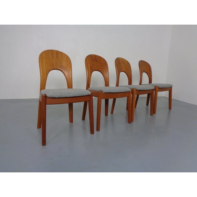 Set of four teak dining chairs from Niels Koefoed and produced by Hornslet Møbelfabrik in Denmark. New upholstery in gray...