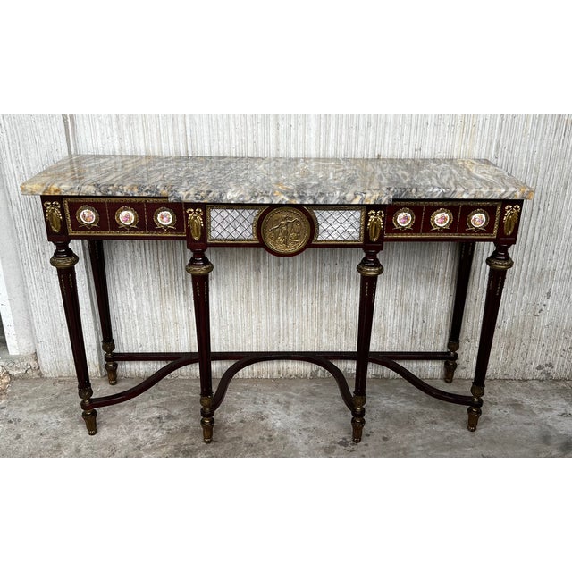 French Napoleon III style console in mahogany with chiseled and gilt bronze trimmings, with hand painted porcelain plaques...