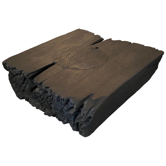 Teak coffee table or side table with beautiful eroded ends. This was originally a rice pounder and we filled in the...