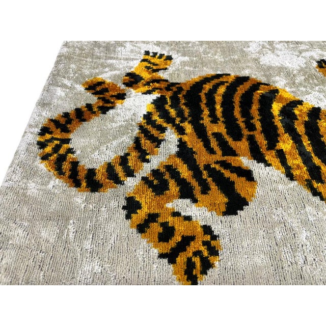 Handmade Velvet Silk IKAT cushion cover with tiger design and shiny colors. It can be a perfect gift for new homes or...
