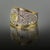 Platinum & 18k Ring by Keith Davis, with 1.02 carat GIA certified Fancy Yellow diamond and 4 trillion cut diamonds...