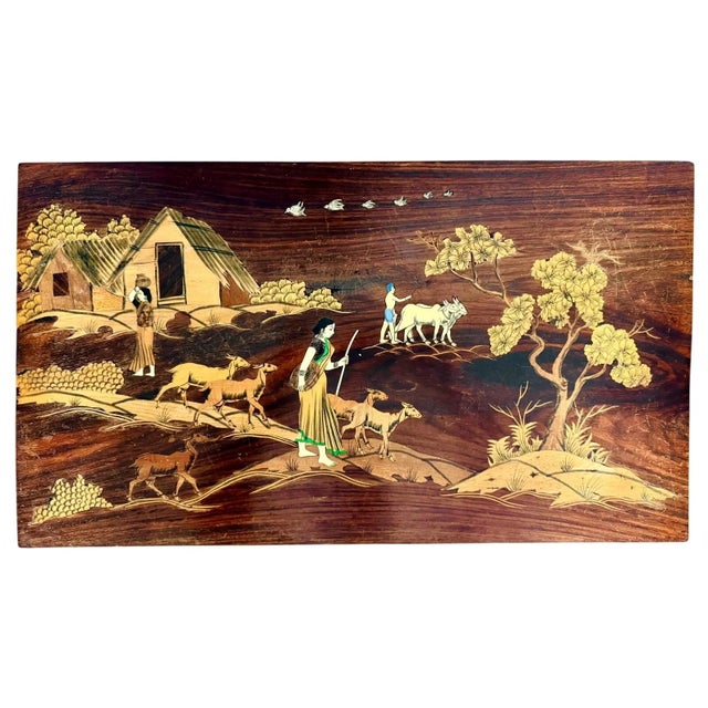 Crafted from richly figured rosewood with hand-cut bone inlay, the tabletop depicts a lively pastoral scene filled with...