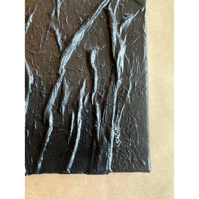 A striking monochromatic abstract panel featuring bold, sculptural ridges that create dramatic movement and shadow....