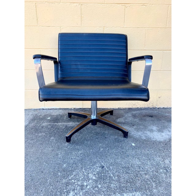 This cool ribbed black swivel lounge chair is roomy and comfortable. The swivel mechanism works great with smooth glide....