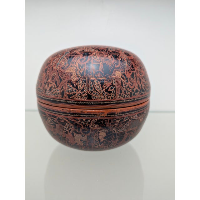 This is an artfully crafted, antique Burmese lacquer box made of wood, traditionally known as a "Kyet Hmauk" (parrot box)....