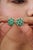 These elegant 6.21 carat emerald and diamond floral cluster stud earrings are crafted in 925 sterling silver and feature...