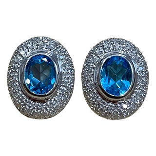 5 Carat Oval Shape Blue Topaz and Diamond Omega Back Clip Earring 14 Karat Gold For Sale
