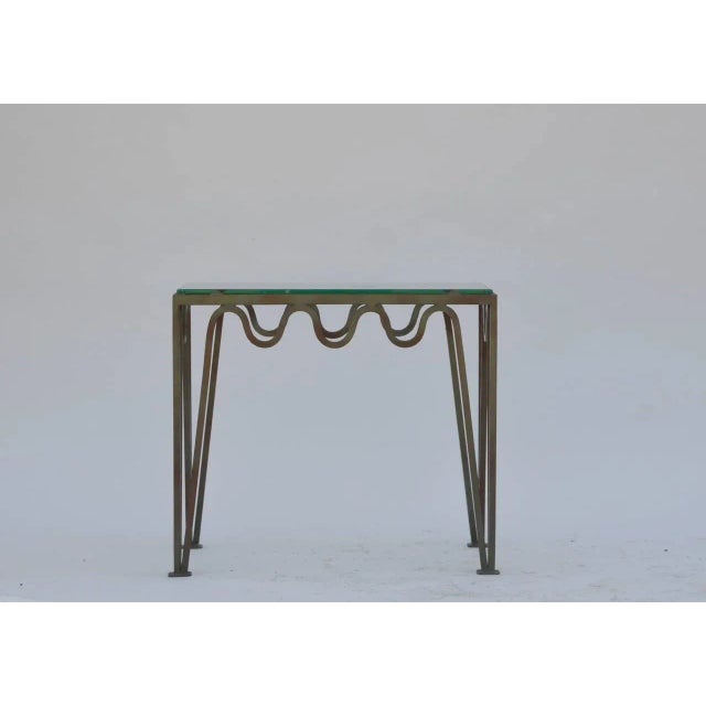 Pair of 'Méandre' verdigris steel and glass side tables by Design Frères. Can be used separately as sofa side tables, or...