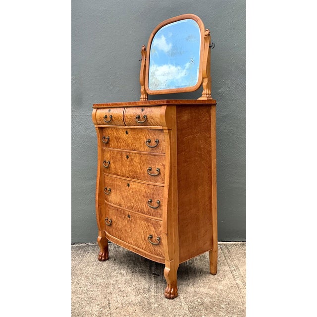 This exceptional early 20th-century chest is distinguished by its richly figured bird’s-eye burl veneer, displaying a...