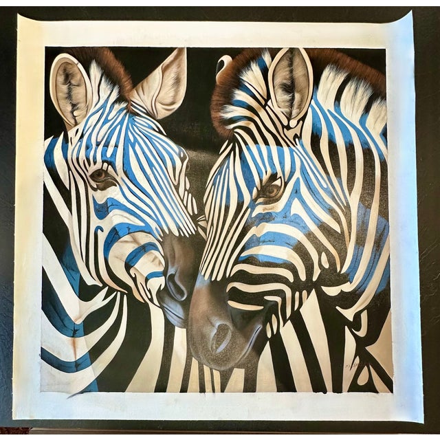 Original oil on canvas featuring a close-up portrait of two zebras rendered in bold black, white, and vivid blue tones....