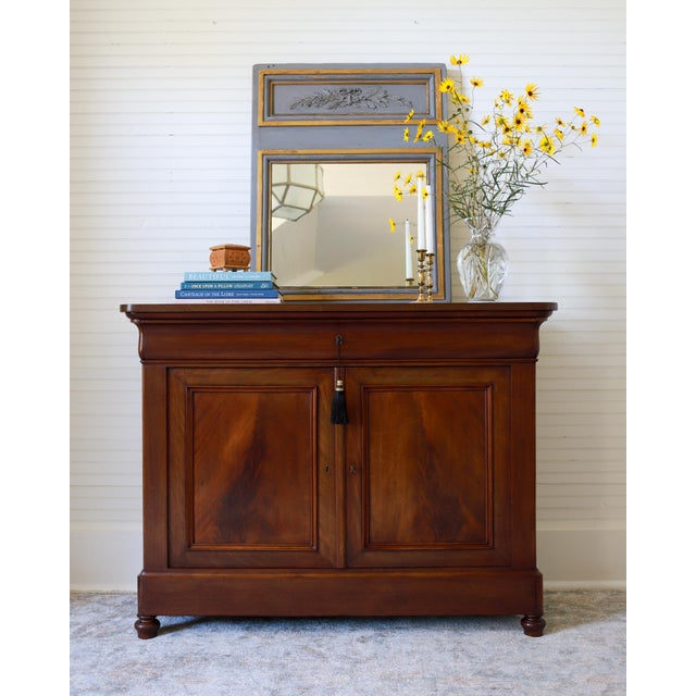 This gorgeous piece is a French Louis Philippe sideboard or enfilade. Dating from the mid-1800's, this piece has been...
