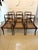 A very elegant set of antique English Regency mahogany dining chairs consisting of five singles and one carver, retaining...