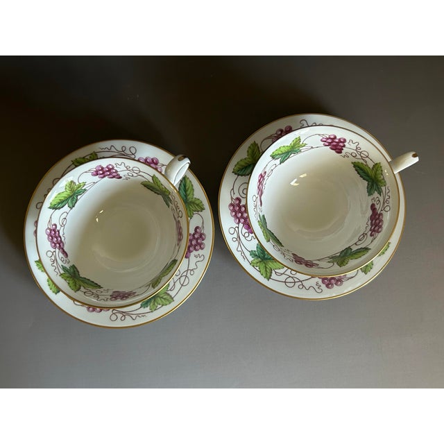 Set of two vintage footed teacups and matching saucers by Spode Copeland, made in England. This elegant set features the...