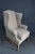 Ethan Allen Upholstered Wing Chair and Ottoman, gray upholstered with white piping, walnut stretcher, ottoman 21w 27d 16h