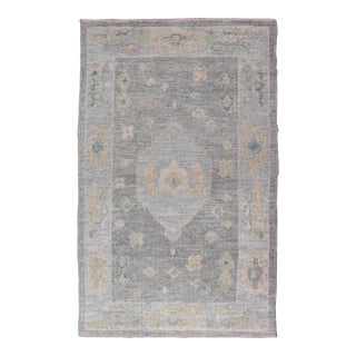 Turkish Oushak Rug With Soft Gray Field and Pale Blue Medallion For Sale