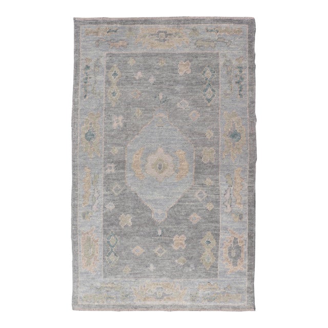 Turkish Oushak Rug With Soft Gray Field and Pale Blue Medallion For Sale