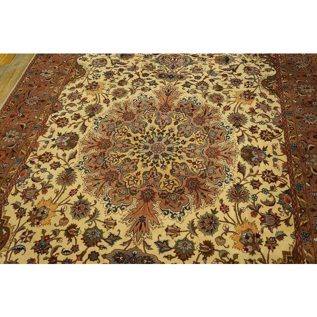 Mid 20th Century Persian Tabriz Carpet ( 5' 10" x 9' - 178 x 275 cm ) A mid-20th-century Tabriz carpet, The piece measures...