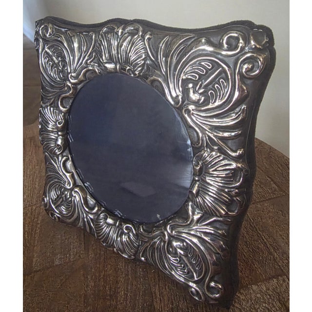 Sterling silver photo frame with round glass image area.