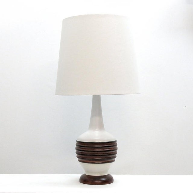 Wonderful tall ceramic table lamp from Denmark, 1960s, with white and faux wood glaze, wired for US standards, one E26...