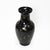 This striking black ceramic vase showcases an enchanting celestial design, featuring hand-painted gold crescent moons and...
