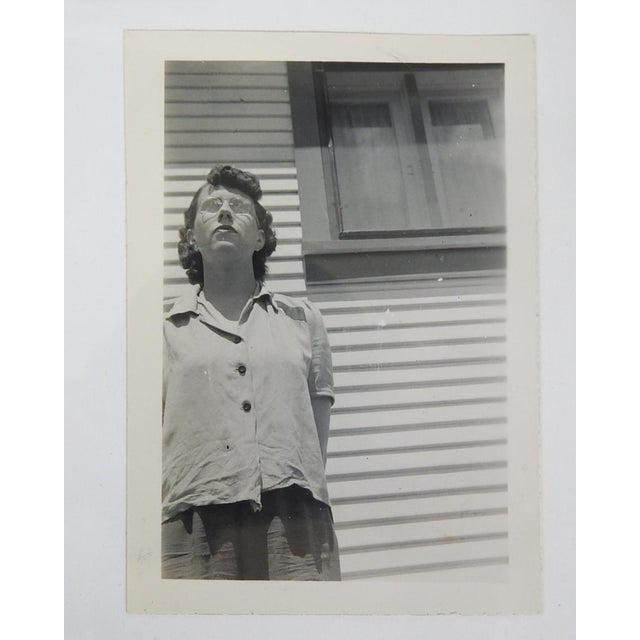 1950's snapshot photograph Don't Look Up. Woman and window out of frame vernacular photo of her looking up. Unframed.