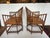 Pair of lovely bamboo and rattan chairs having handpainted birds and custom cushions. 21” W x 35.5” H x 21” D Arm 27” H...