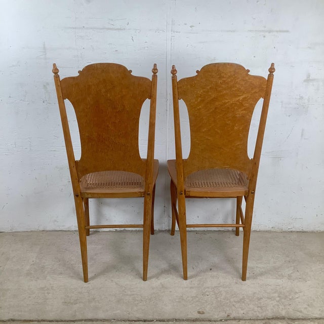 This elegant pair of antique side chairs showcases the refined decorative styling popular at the turn of the twentieth...
