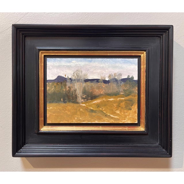 This oil painting captures the serene landscape of Pike's Peak, showcasing a harmonious blend of earthy tones and soft...