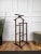 Vintage 1970s Italian wood dressboy valet stand, with classic carved column and pedestals completed by the fine and...