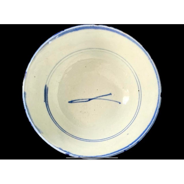 Chinese Hand-painted Porcelain Bowl. Bowl features freehand cobalt-blue brushwork, characterized by the expressive, fluid...