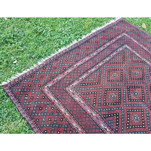 This is a vintage handwoven Afghan Baluch rug. Handwoven with high quality pure wool.
