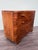 This is an elegant chest of drawers dating back to the 1930s. The piece features a highly figured burl veneer, displaying...