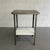 Antique, industrial, zinc covered, cast iron, apothecary prep table features an enameled cast iron lower shelf at 11...