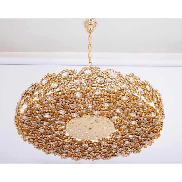 A huge wonderful and high-quality gilded chandelier/pendant light fixture by palwa (palme & walter), germany, 1970s it is...