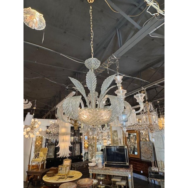 This modern Murano chandelier features a unique leaf form design in a subtle Fontana Green color. Perfect for contemporary...